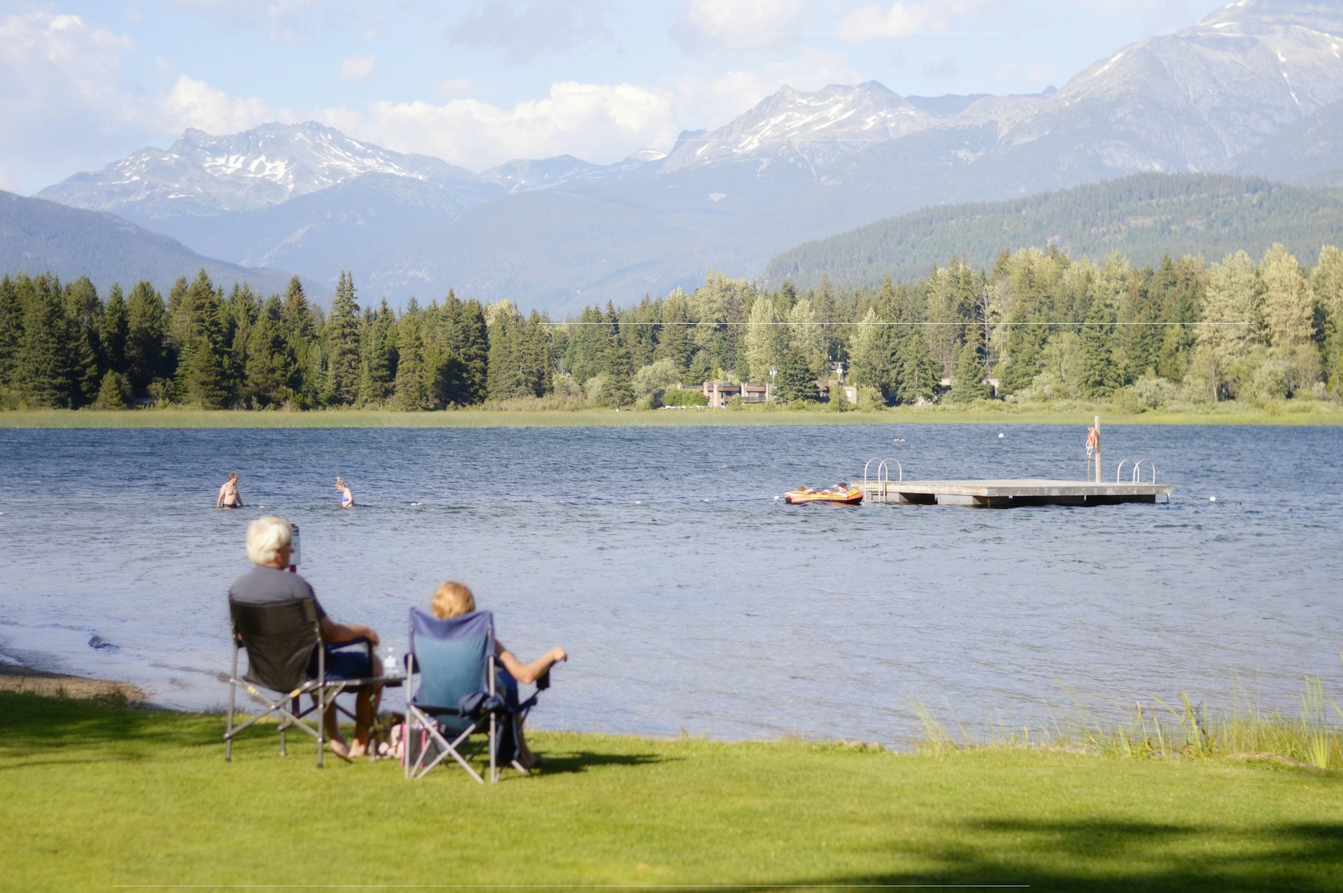 Cross Border Financial Planning Abroad - The Ultimate Guide- Article Two Expats sat by a Lake