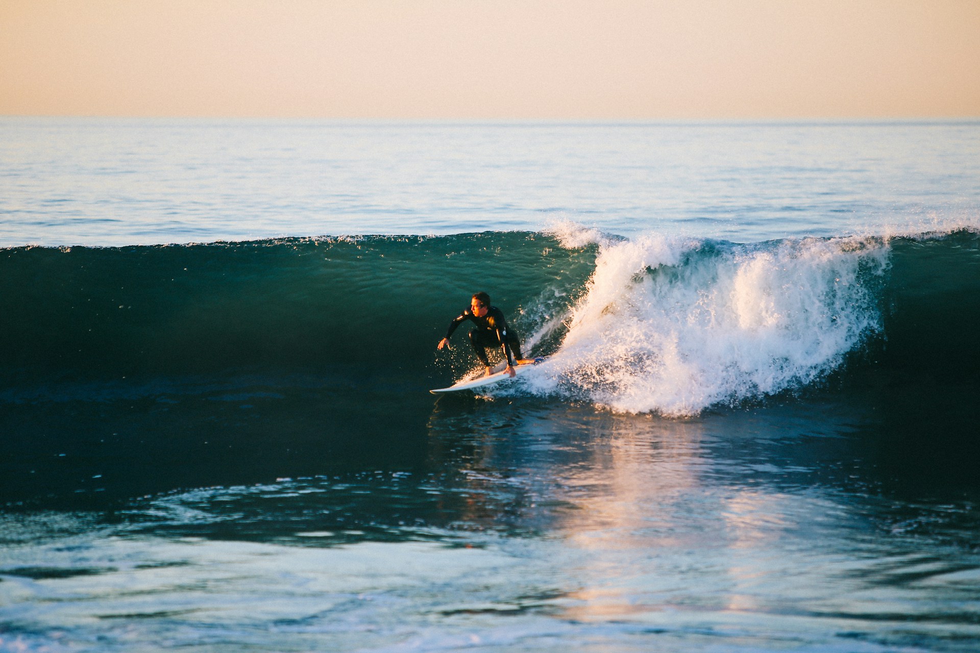 Cross Border Financial Planning - Brit-moving-to-Australia Man surfing in Australia