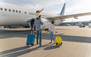 Expat Family in front of a plane